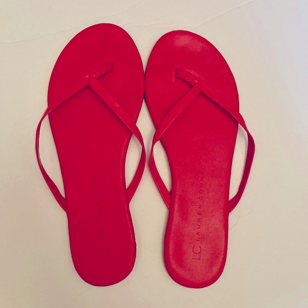 These flip flop sandals are LC Lauren Conrad and are a size 6. They are Hot Pink